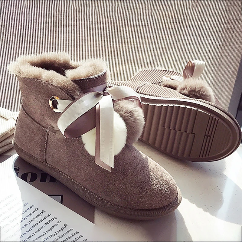 

Women Snow Boots Plush Ball Fur Wool Winter Boots Genuine Leather Ankle Boots Flat Black Ribbon Women Shoe Fashion Ladies Shoes