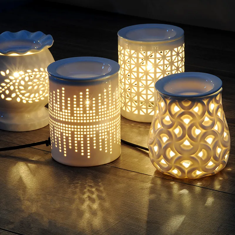 Quemador de aceite de cerámica eléctrico blanco hueco fragancia lámpara