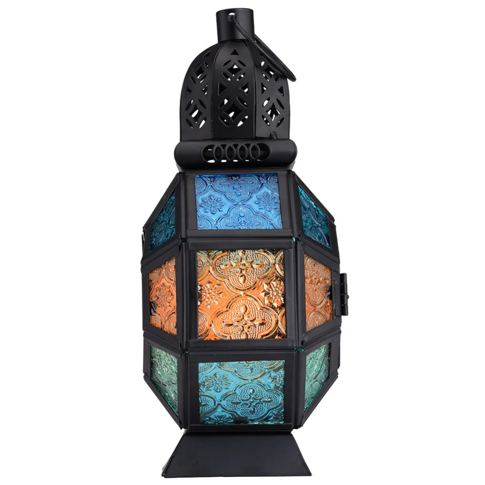 Beautiful wrought iron candle holder with stained glass. Beautiful wrought iron candle holder with stained glass.