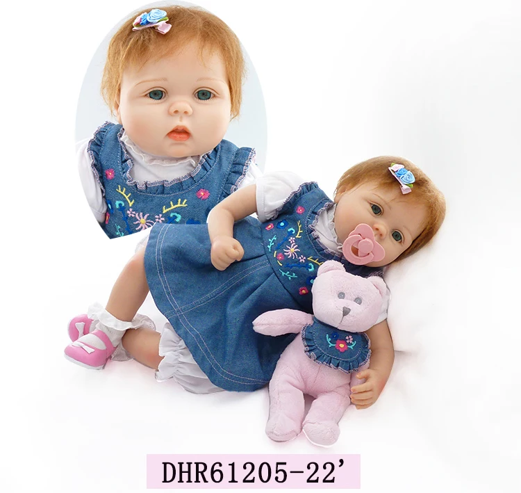 

22in 56cm popular handmade lifelike newborn baby girl with denim skirt and one toy bear bebe bonecas silicone reborn baby doll