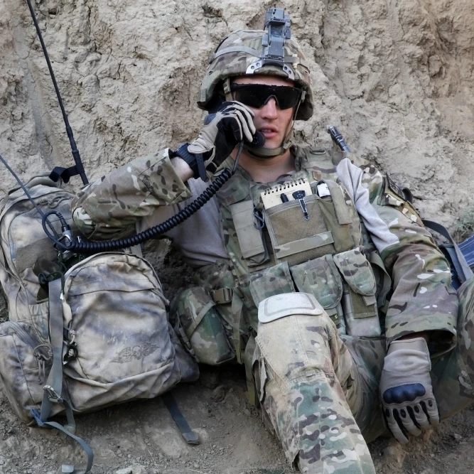 U.S. Army Specialist conducts a radio check Poster Print (17 x 11)