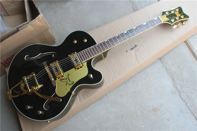 Factory custom black hollow body electric guitar with golden hardware