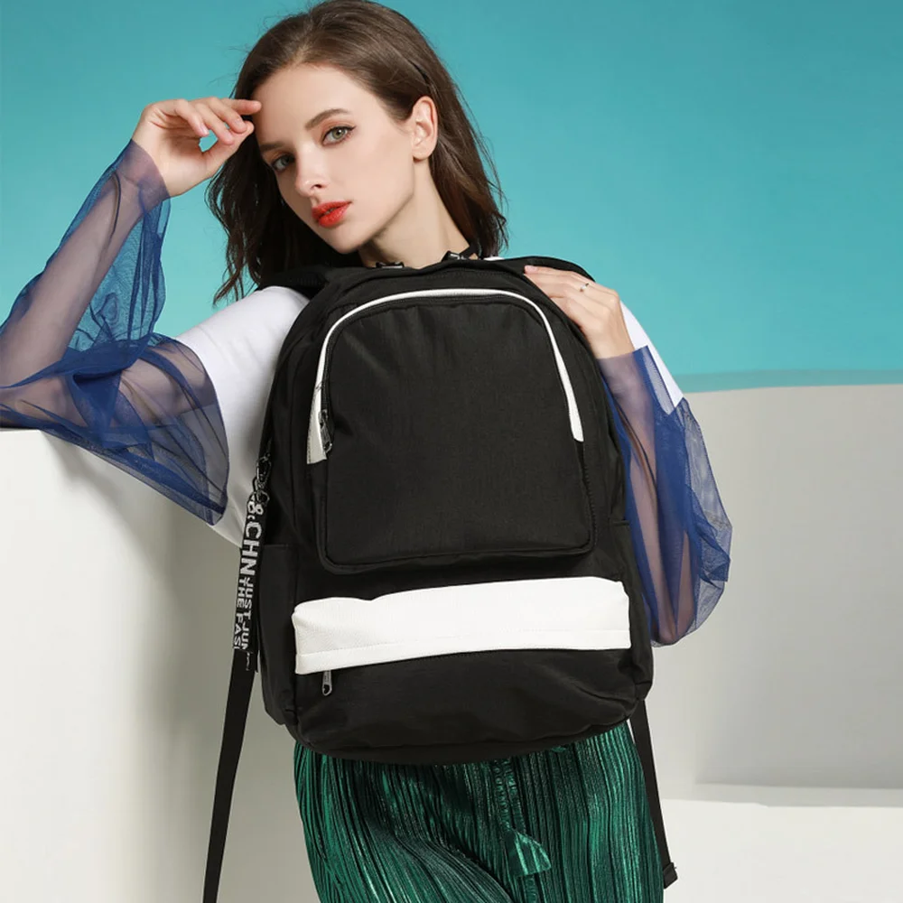 

2018 new backpack student backpack casual bag large capacity anti-splashing USB headset hole multi-function backpack
