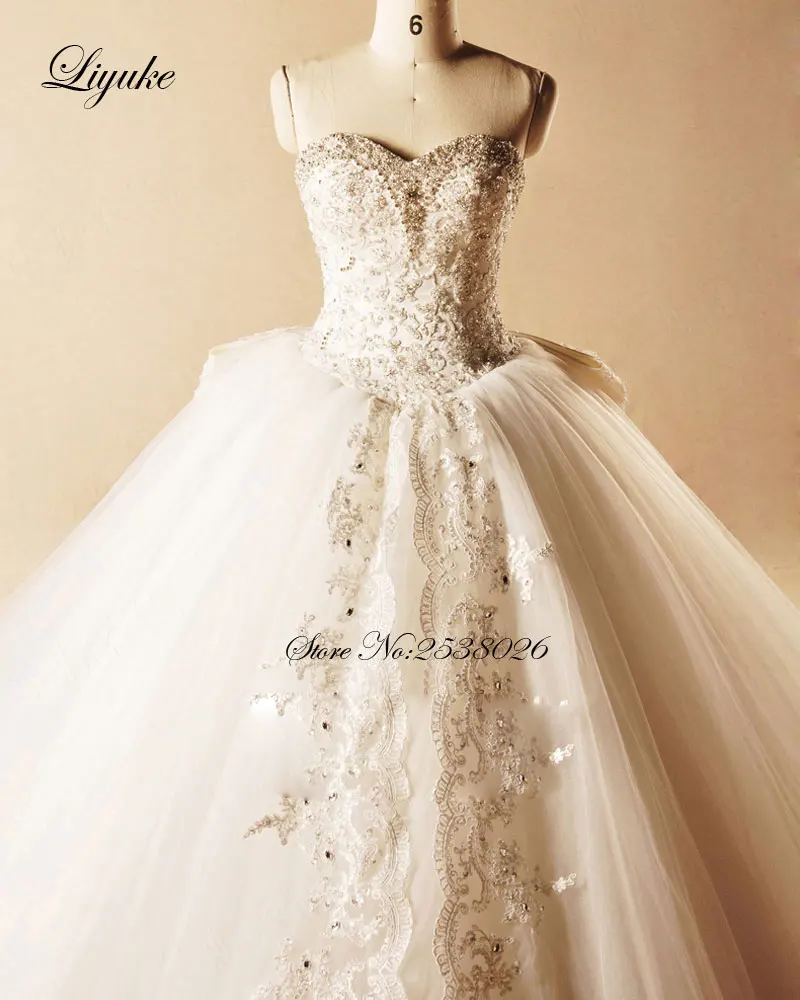 Liyuke элегантный вечернее платье без бретелей свадебное платье с бантом 2019 Бисер аппликации кружева принцесса свадебное платье