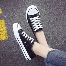2019 spring new wild white canvas shoes flat cross strap casual canvas shoes
