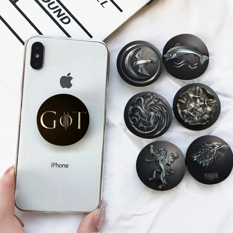 

Hot Game of Thrones Figure Mobile Phone Bracket House Stark Lion Chaveiro Airbag Anti-Drop Extensible Mobile Phone Accessories