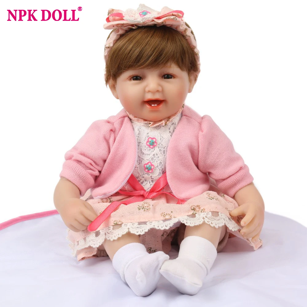 Кукла NPK Reborn Baby 45 см силиконовая улыбающаяся розовая Bebe бант ободок для волос