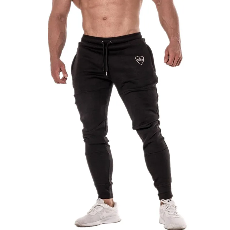 YEMEKE جديد الجمنازيوم رجل ركض السراويل اللياقة البدنية عارضة الأزياء العلامة التجارية ركض Sweatpants أسفل Snapback السراويل الرجال سراويل تقليدية