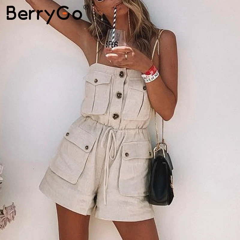 

BerryGo Casual sexy strap pockets summer jumpsuit women Vintage lace up button short jumpsuit female Beach loose solid rompers
