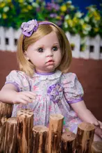 Muñeca reborn de 60 cm con vestido lila