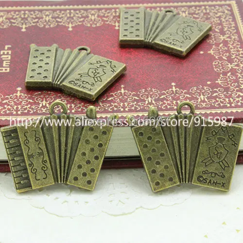 

10pcs/lot 25*32mm Fashion Vintage Bronze Metal Lovely Musical Instruments pendant Jewelry Charms Pendants Jewelry Findings A2748