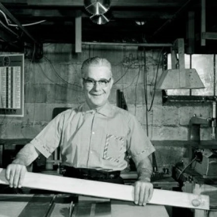 Portrait of manual worker holding level in workshop Poster Print (18 x 24)