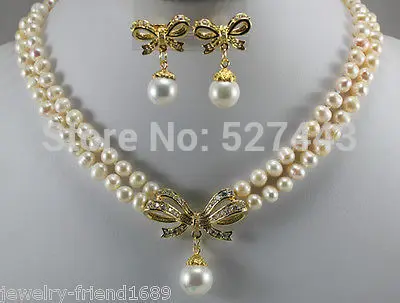 

Wholesale White cultured pearl necklace + bow pendant earrings (A0423)