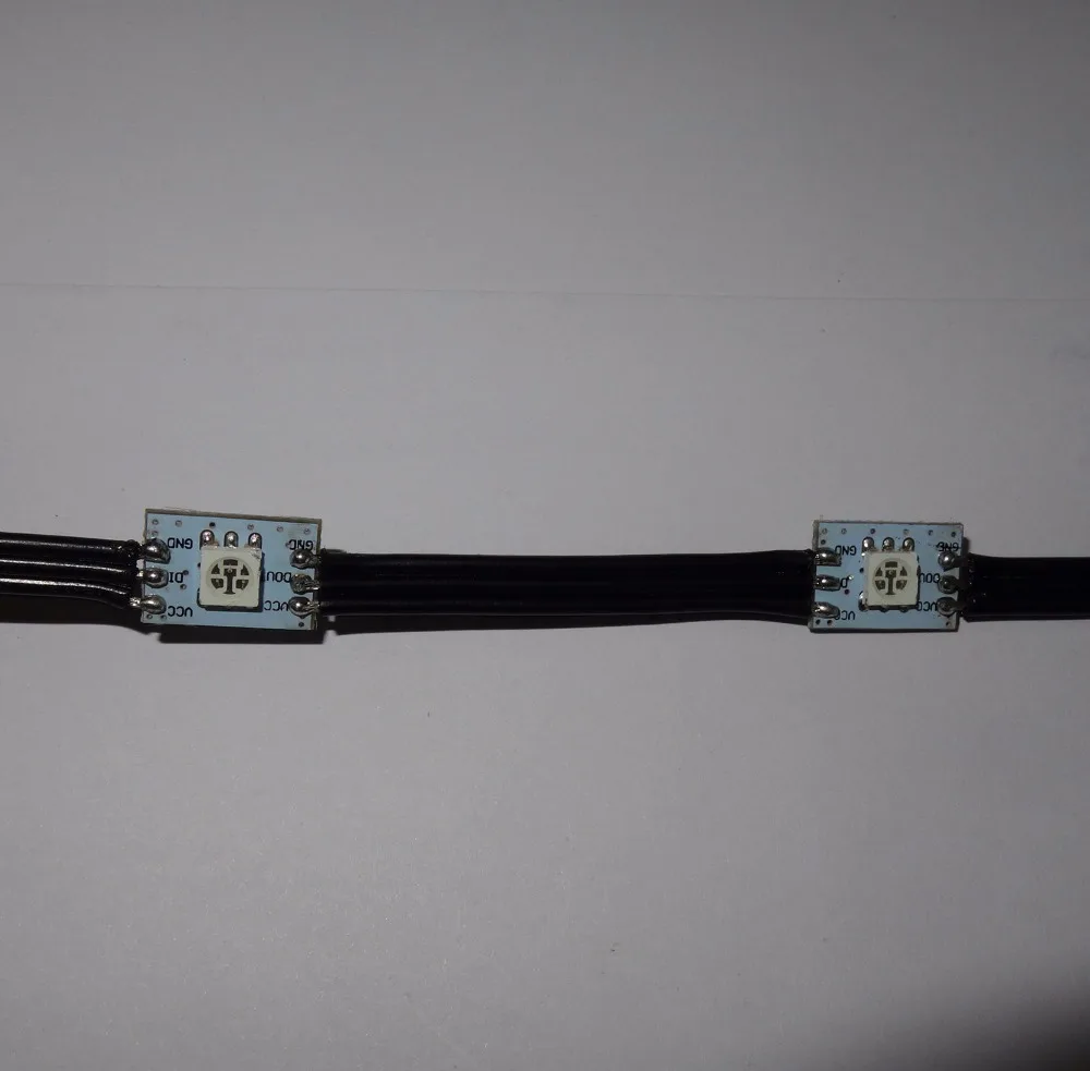 

Black DC5V WS2811 led 5050 SMD pixel node;100pcs a string;black wires;5cm wire spacing