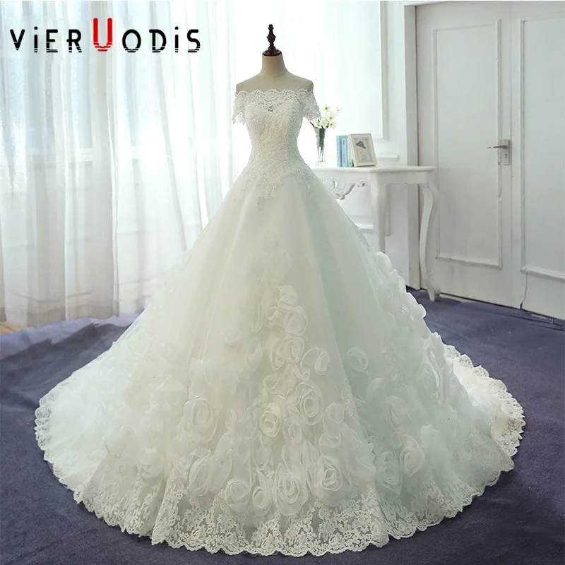 wedding dress with flowers on bottom