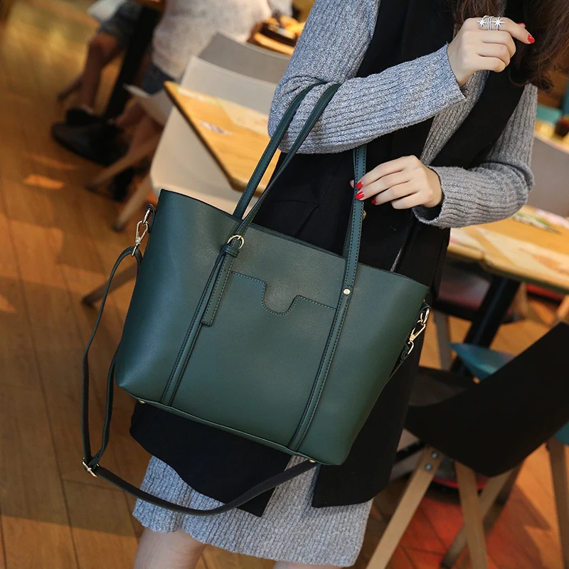 Simple and beautiful Genuine Leather duffle bag New belt decoration women handbags Fashion wild spring and summer shopping bags