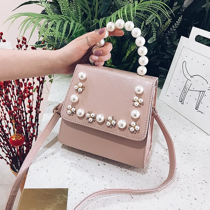 

2019 new retro handheld Pearl small square bag single shoulder oblique bag