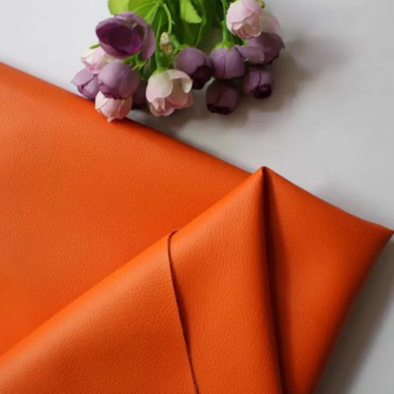 

Orange Synthetic Pu Leather Fabric Material Faux Small Pebbled PU Artificial Leather Upholstery Fabric Purse Textile Decoration