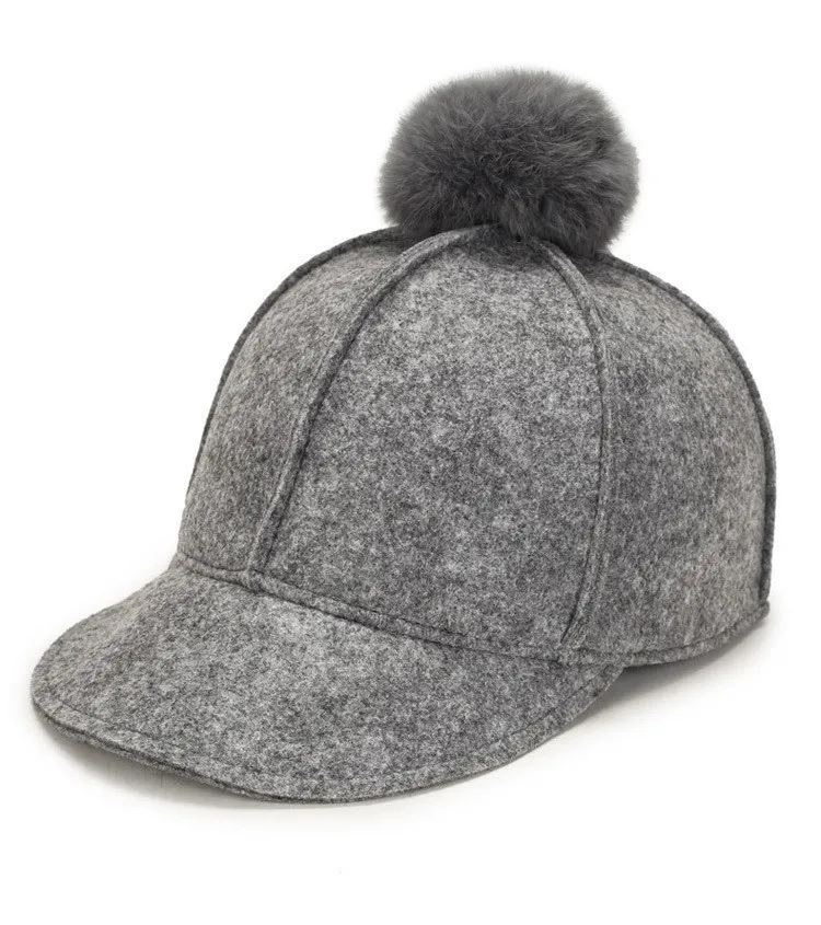 fitted hat with fur ball