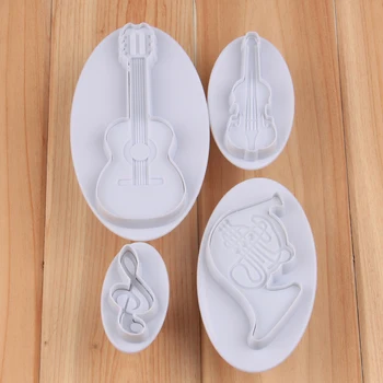 

Free Shipping High Quality Plastic 4pcs Musical Instruments Cookie Plunger Cutters Cake Decoration Fondant Molds set