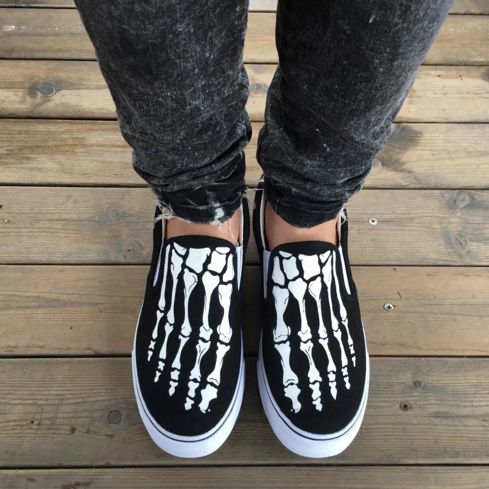 vans slip on skeleton foot