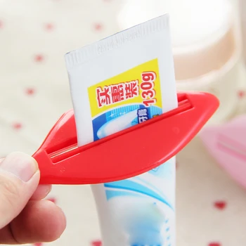 

Lip Shape Toothpaste Tube Face Wash Cleaning Foam Cream Roller Squeezer Dispenser ABS Clip Random Color