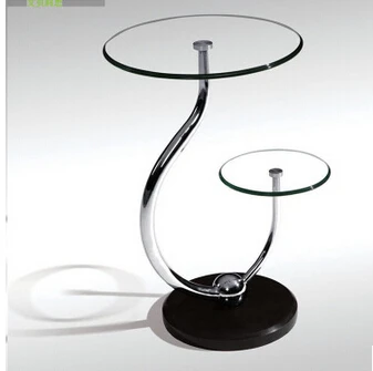 Toughened glass small tea table. Phone. Sofa. The round table