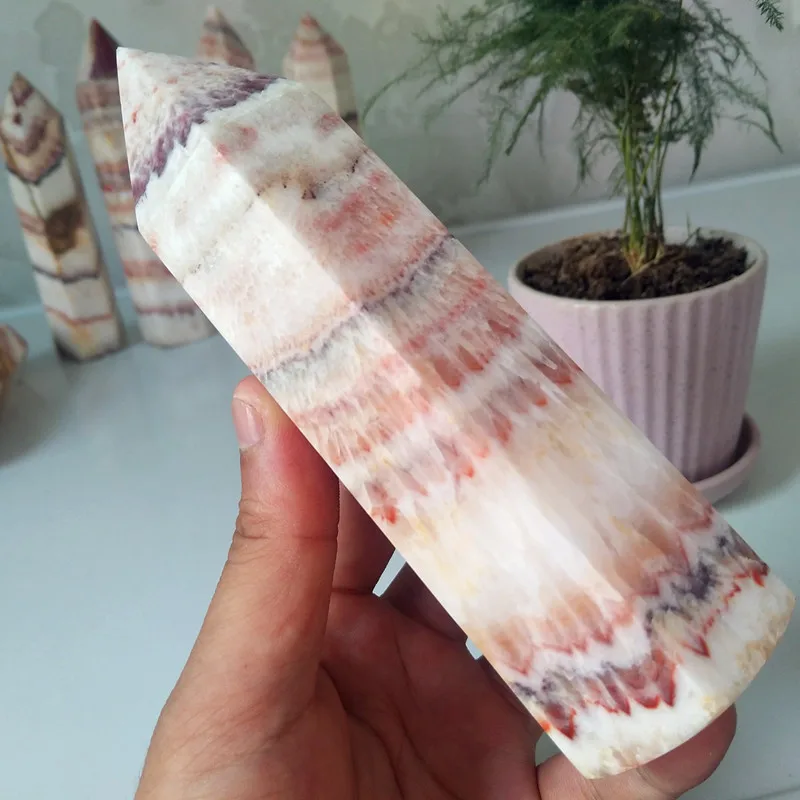 A Oversized stone wand point natural rhododendron crystal decorated obelisk and hexagonal crystal point healing crystals