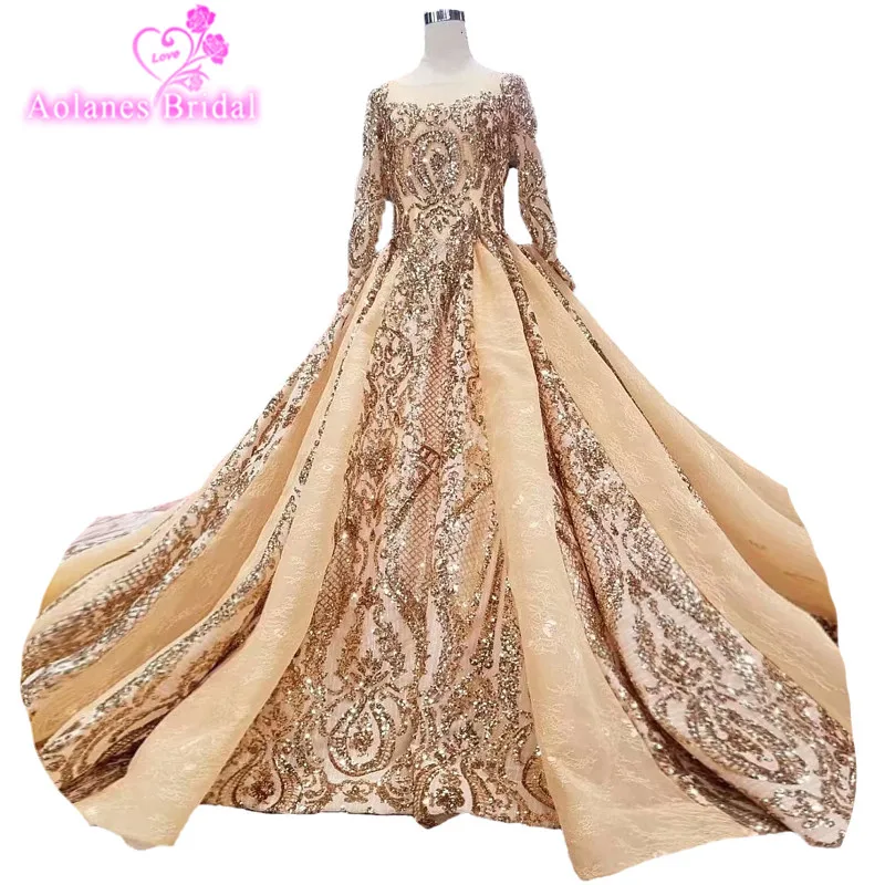 

2018 Luxury Champagne Gold Lace Sequin O-neck Chapel Train Bridal Gowns Long Sleeves Backless Ball Gown Backless Wedding Dresses