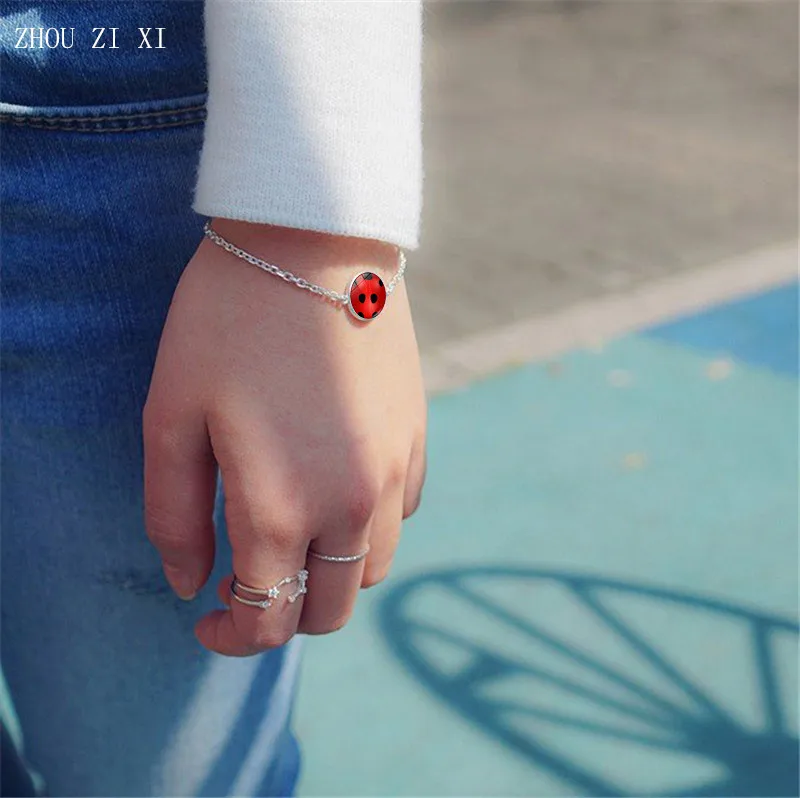 

Lady bug cartoon series European and American style anime character Ladybug Chat Noir glass gem metal bracelet Toys for children