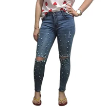 ripped jeans with pearls on them
