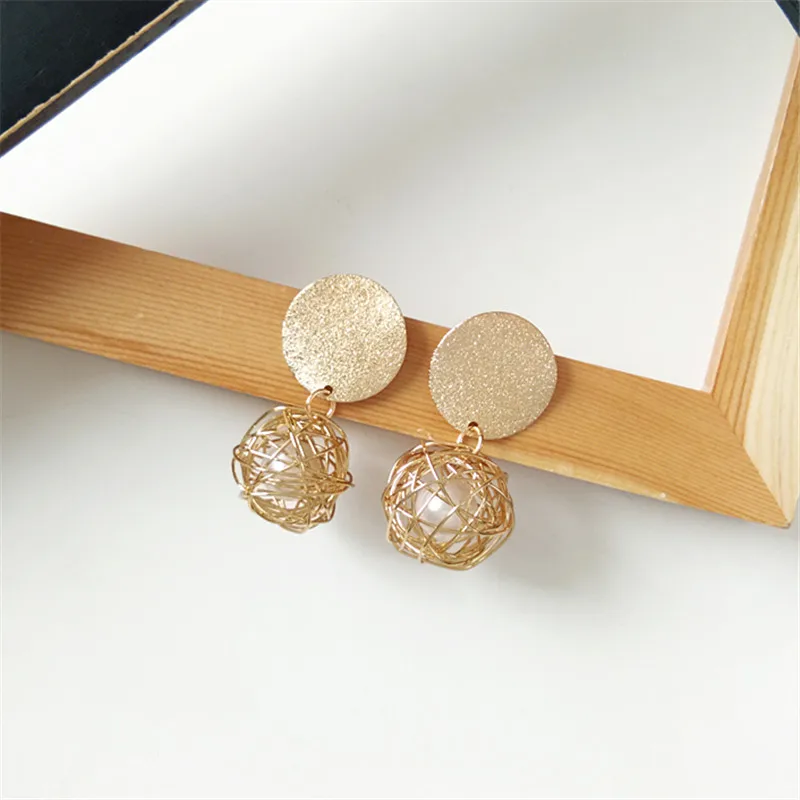 

Contracted and fashionable metal earrings weaving temperament pearl earrings net 2018 Fashion jewelry wholesale