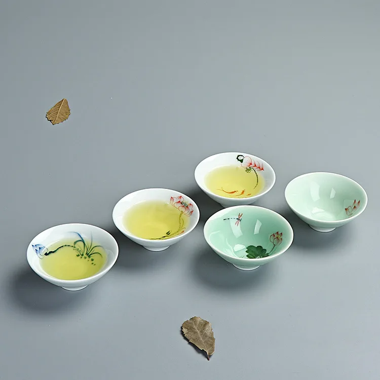 

Manufacturers wholesale hand-painted anaglyph fish celadon teacup lotus sample tea cup master single cup hat to cup of tea cups