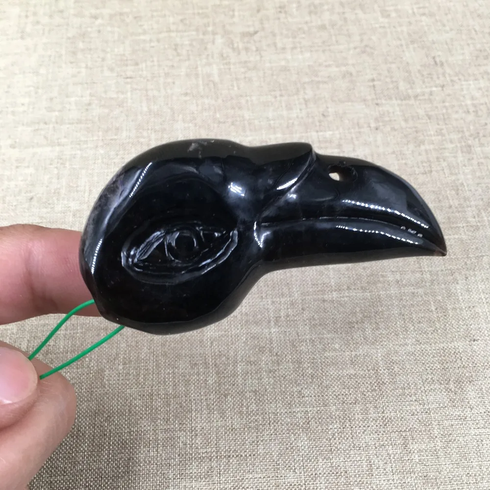 

NATURAL QUARTZ CRYSTAL carved bird skull T1334