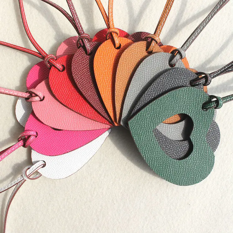 

Famous Brand Luxury Two Colors Real Leather Silk String Lucky Love Heart Keychain Genuine Leather Heart Women Bag Charm Pendant