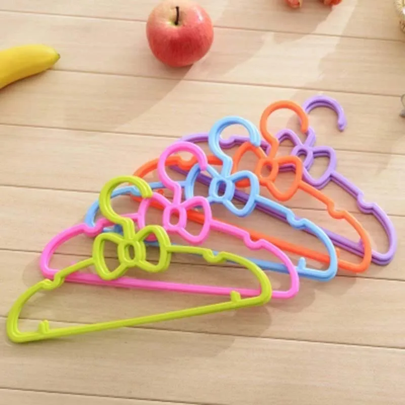 

27*14cm Baby bowknot hanger child clothes pegs plastic kids clothes hangers for clothes drying rack cloth hanger storage 1Piece