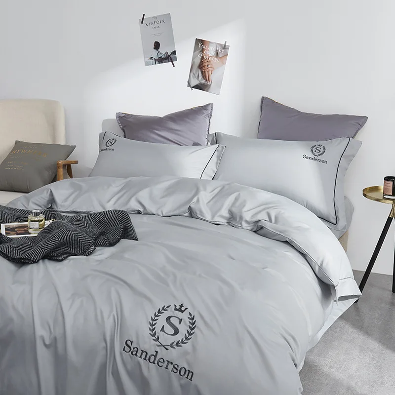 

Solid color embroidery 100% silk four-piece ice silk white sheets are covered with satin. Summer cool four-piece bed sheets