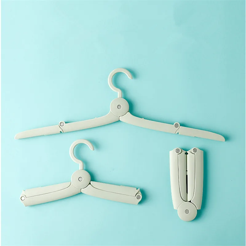 

Magic Creative Portable Folding Clothes Hanger Candy Color Anti Skid Multifunctional Rack Home Travel Cloth Hangers