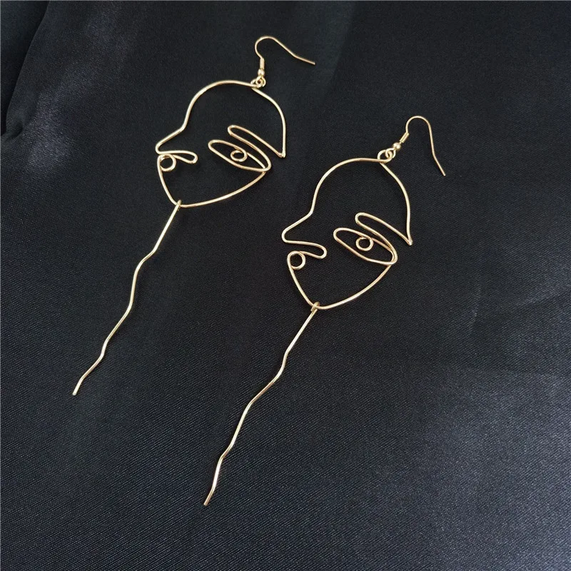 

Free shipping fashion ladies jewelry Female long earrings hollow face contours ear shape pendant fun personality popular