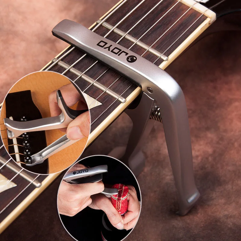 

Alloy Metal Opener Guitar Capo Quick Change Guitar Turner Clamp Key for 6-String Acoustic / Electric Guitar Parts JOYO JCP-02