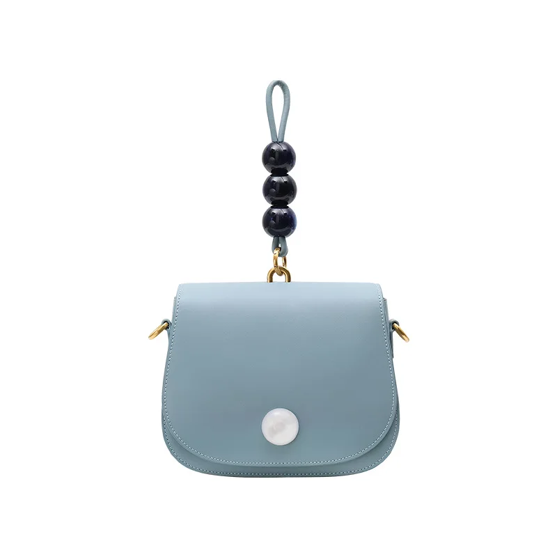 

Simple design pearl saddle bag 2019 new single-shoulder cross-body small round bag fashion Korean version of cowhide lady bag