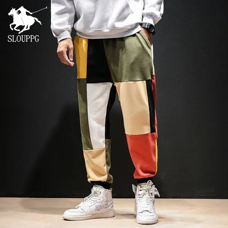 

Men's casual pants plus fertilizer Color Block Patchwork trousers men's tide brand loose beam feet sports Japanese hip hop pants