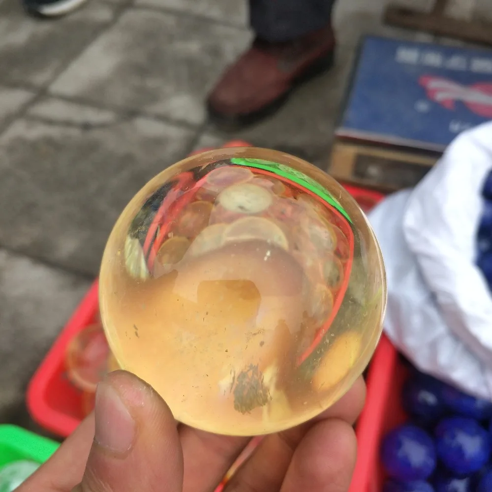 

The ball of beautiful yellow melting stone hand burnish can bring good luck for household adornment