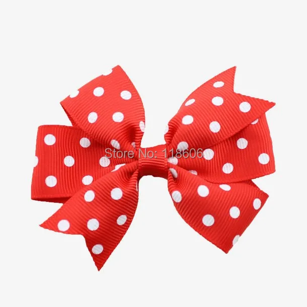 Red Polka dot pinwheel hair bow.jpg