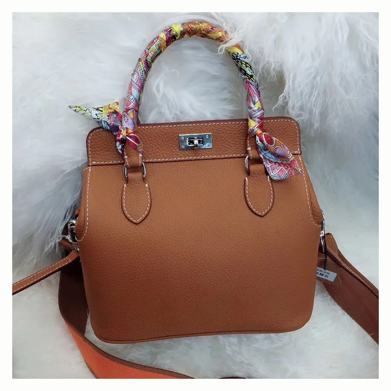 

Women's new leather lychee pattern bag Europe and the first layer of leather doctor bag dumpling-type milk box package