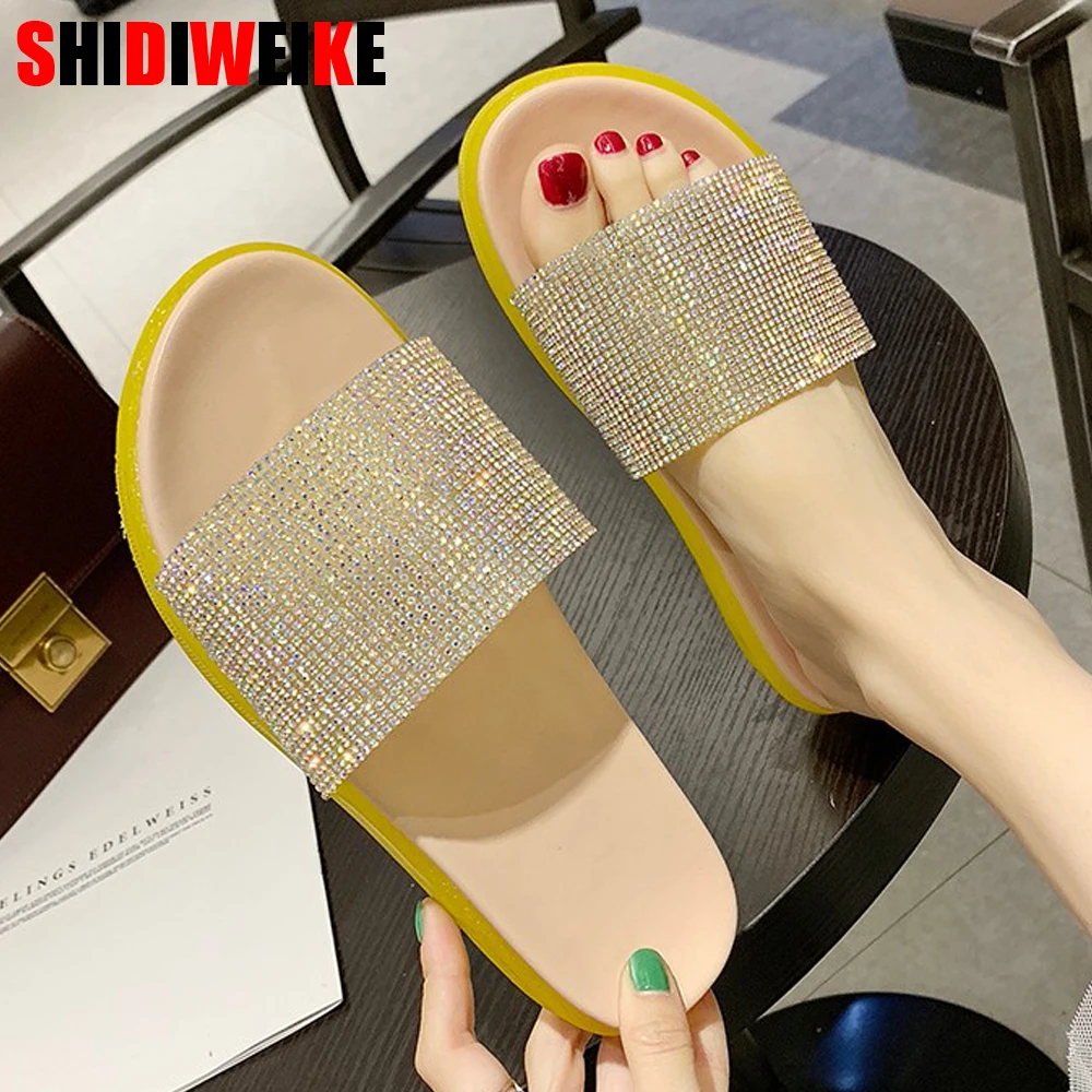 

Korean version of the 2019 summer new fashion slippers women wear rhinestones flat bottom word drag seaside beach sandals womans