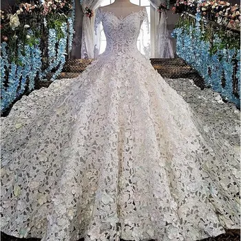 شراءفستان زفاف فاخر من Modabelle مزين بزهور من الدانتيل باللون العاجي فستان حفلات بأكمام طويلة Vestido Para Casamento
