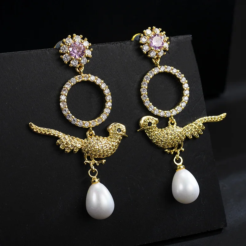 

Korean version of the new inlaid zircon bird earrings female personality sweet temperament pearl earrings
