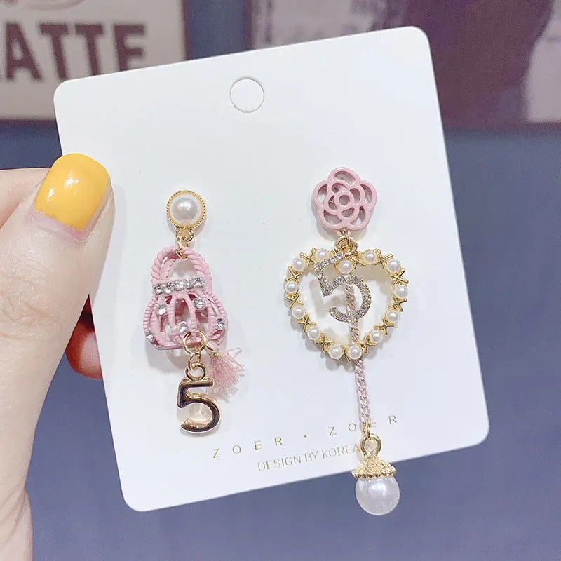 

Fashion Wweet Asymmetrical Hollow Flower Pearl Love earrings Small Fragrance no.5 backpack tassel earring