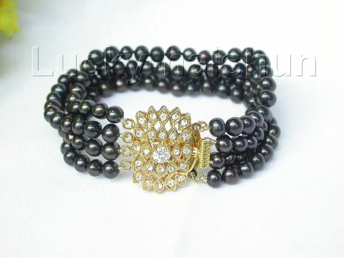 

Hot selling free shipping********Excellent 4row 7mm round black freshwater pearl bracelet 8